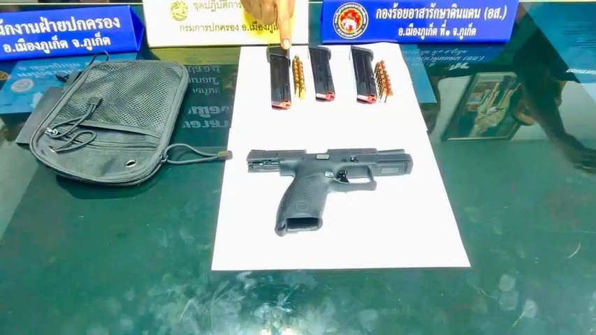 View full size Phuket checkpoint search finds gun and bullets under BMW seat